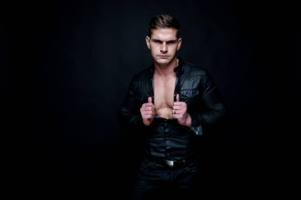 istock Attractive muscular man wearing black 1134489883