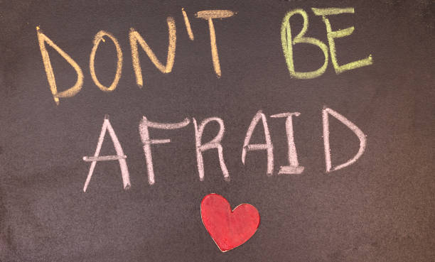 istock don't be afraid handwriting with colorful chalk and heart 1134491599