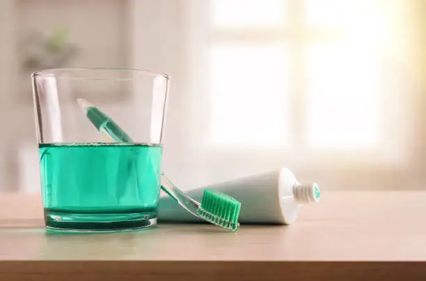 Photo of Concept oral hygiene on wood table in bathroom at home