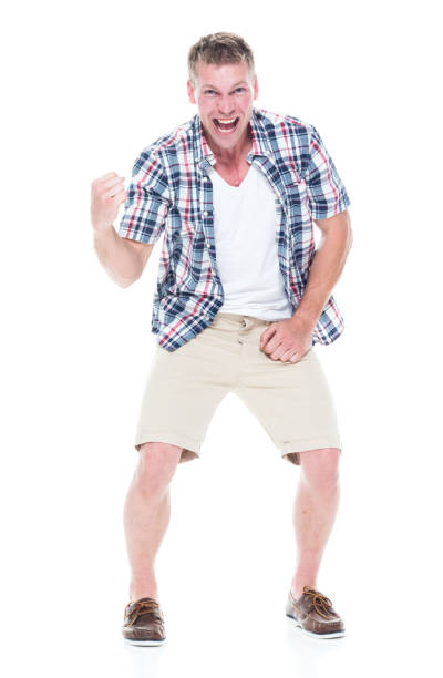 istock Handsome man in shirt and shorts is excited 1134493377