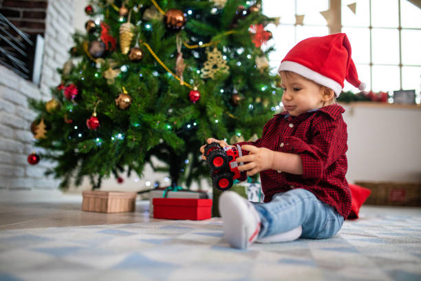 istock Little boy playing with plastic toy car 1134493665