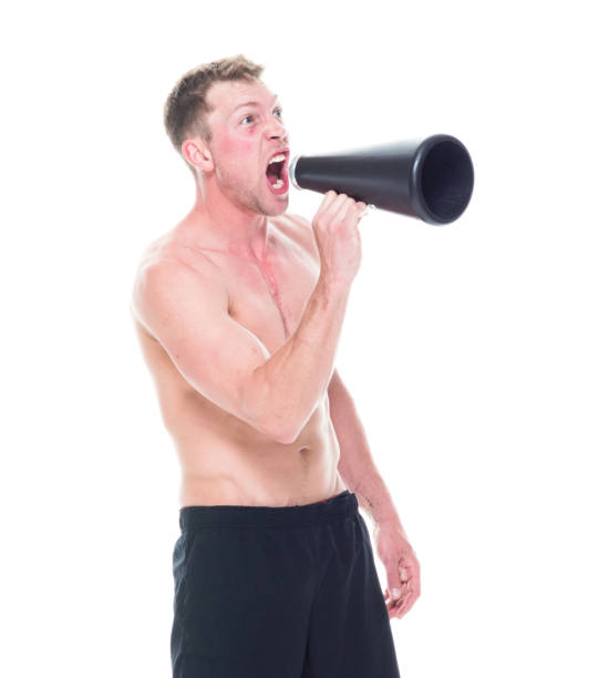 istock Handsome shirtless man is yelling into a megaphone 1134493994