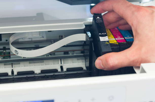 Refilling third party printer cartridges, inkjet. stock photo