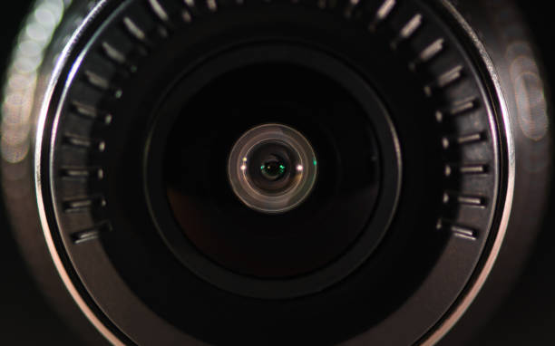 istock The camera lens with colored light, close photos 1134496097