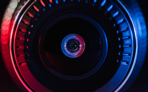 istock The camera lens with colored light, close photos 1134496155