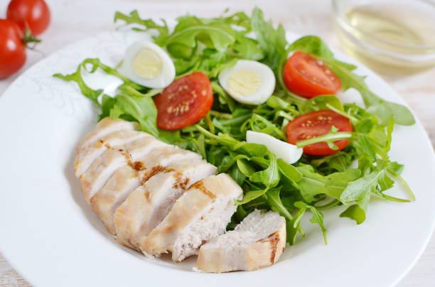 istock Chicken Salad Arugula Oil Quail Eggs Tomato Lemon Vegetables 1134496237