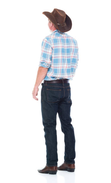 istock Handsome cowboy is standing with hands by side 1134497898