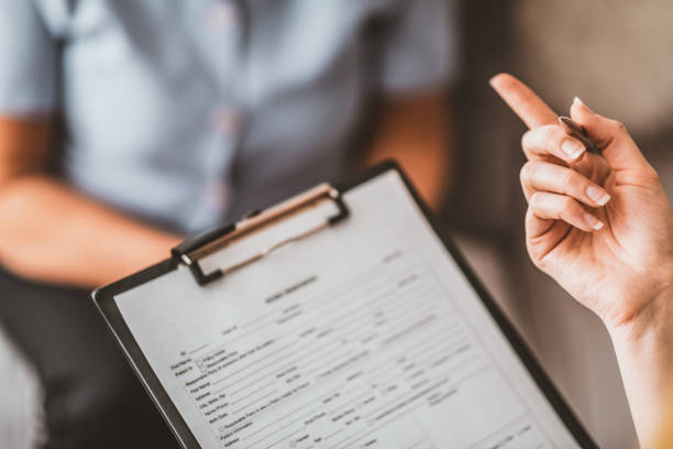 istock I'll go over the paperwork with you... 1134502278