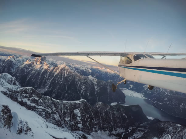 istock Airplane Flying in the Mountains 1134504034