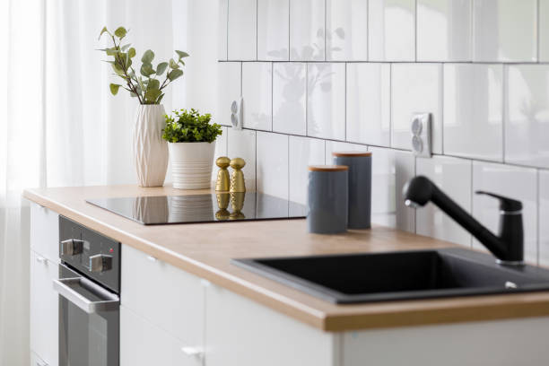 istock White kitchen with wooden countertop 1134504417