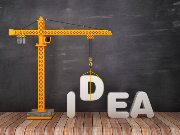 istock Tower Crane with IDEA Word on Chalkboard Background - 3D Rendering 1134505635
