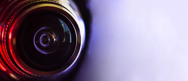 istock Camera lens and red backlight . Horizontal photography. Banner 1134506238