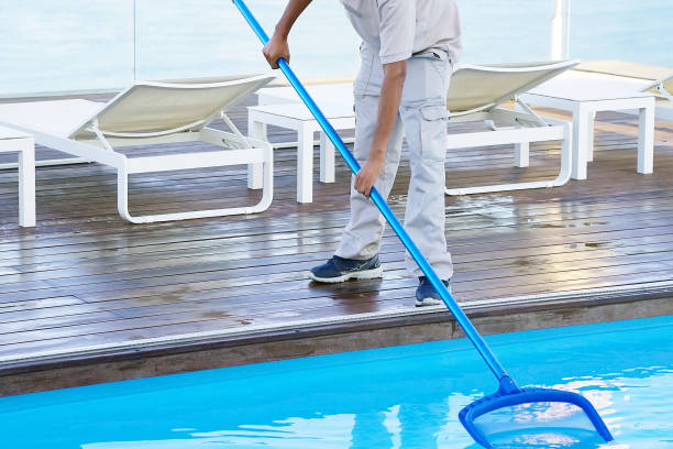 istock Hotel staff worker cleaning the pool 1134506496