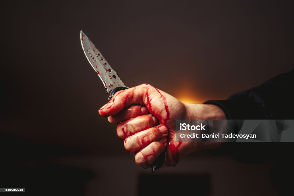 murder Male hand with bloody knife Knife Crime Stock Photo