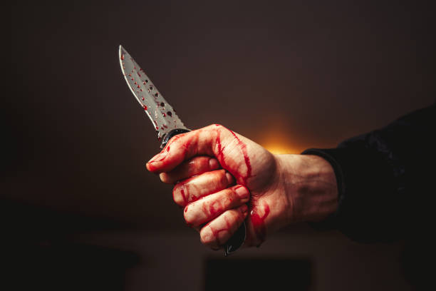 murder Male hand with bloody knife acute angle photos stock pictures, royalty-free photos & images