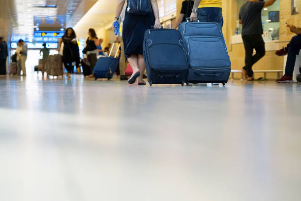 istock People with suitcases at the airport bottom view 1134506842
