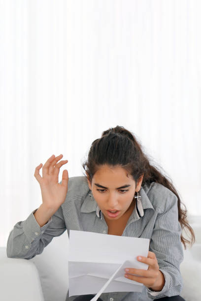 istock Young woman got a bad letter uvolnenii 1134507960