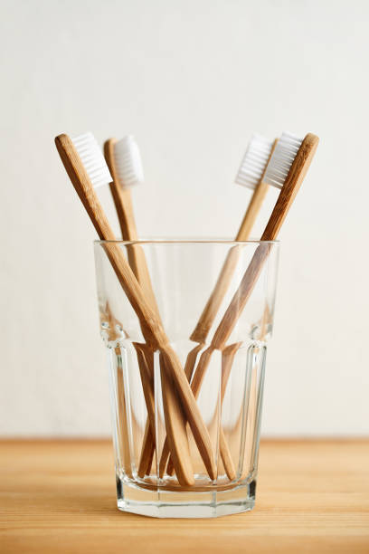 istock Four bamboo toothbrushes in a glass 1134508673