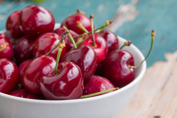 istock Fresh red cherries in a bowl, outdoors on a garden table 1134508923