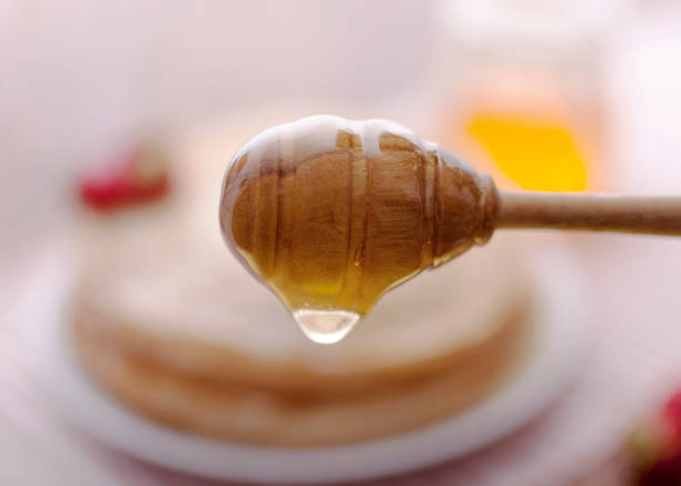 istock Hot and fragrant pancakes with honey 1134508928