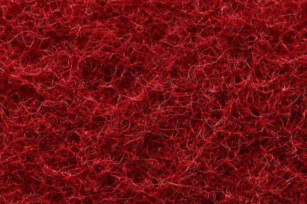 la textura de la superficie de hilos rojos entrelazados de fibra sintética abrasiva. - felt tipped fotografías e imágenes de stock