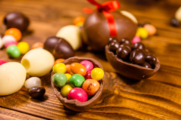 istock Chocolate easter eggs and multicolored candies on wooden table 1134510207