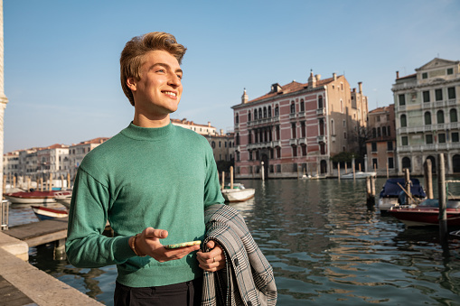 Italian millennial out in early morning in Venice - Italy