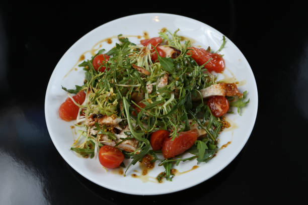 istock restaurant dish, green salad, cucumbers, red pepper, boiled meat, arugula, tomato and grapefruit, healthy food, close-up, for the menu 1134510996