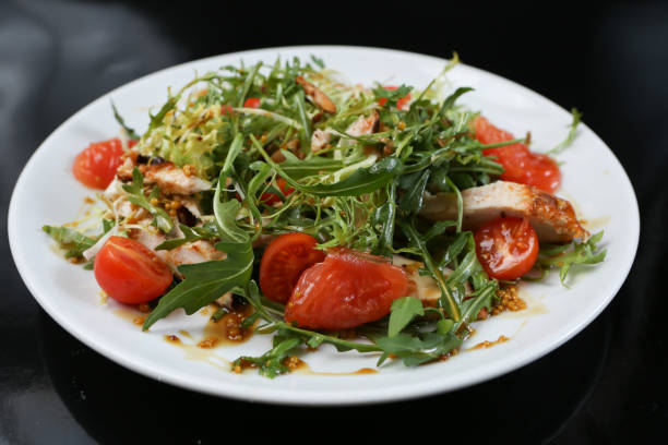 istock restaurant dish, green salad, cucumbers, red pepper, boiled meat, arugula, tomato and grapefruit, healthy food, close-up, for the menu 1134511140