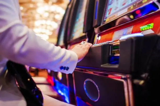 Photo of Woman Playing Slot Machine