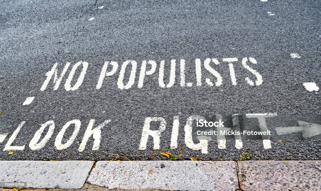 Road text that has been supplemented with a warning against populism, which is spreading more and more around the world. Populism Stock Photo