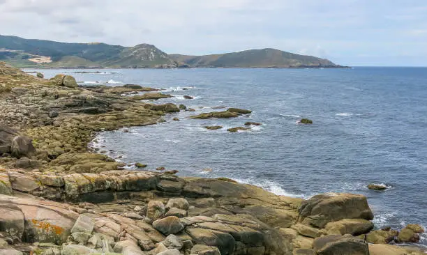 Rocky coastline near Nosa Senora da Barca Church in Muxia, A Coruna Province, Galicia