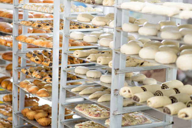 racks with finished and raw dough products in a bakery