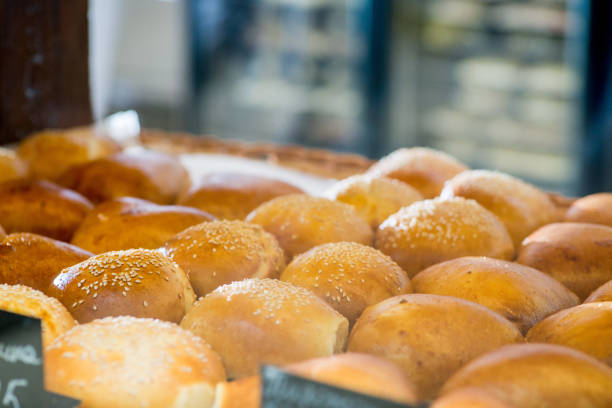 buns and pastries in a basket on the bakery shop window