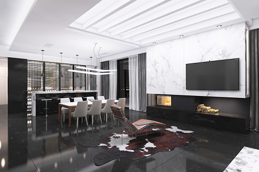 Modern luxury villa interior. Large living room with TV above a fireplace. Kitchen and dining room in the back. White marble on the wall. Render