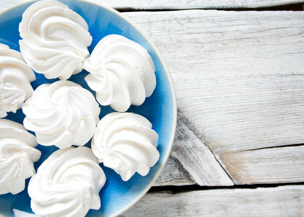 istock beautiful meringue on wooden surface 1134521881