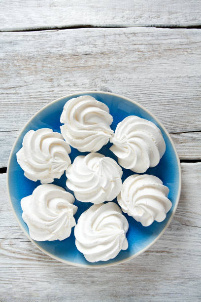 istock beautiful meringue on wooden surface 1134521884
