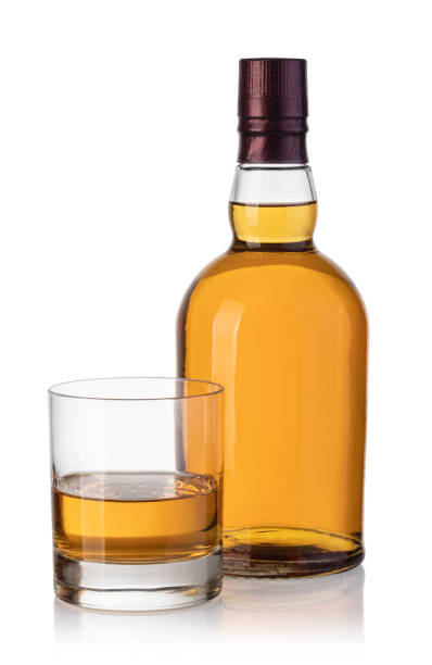 istock whiskey bottle and glass 1134522127