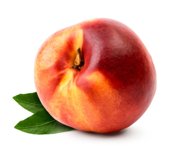 istock Ripe nectarine with leaves close-up on a white. Isolated. 1134524196