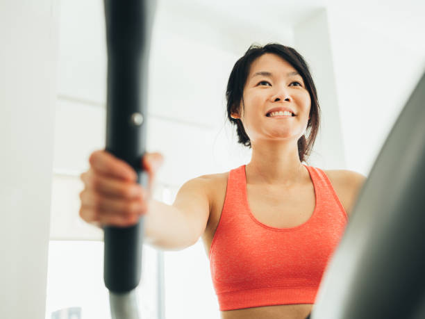istock Young Asian woman working out 1134524210
