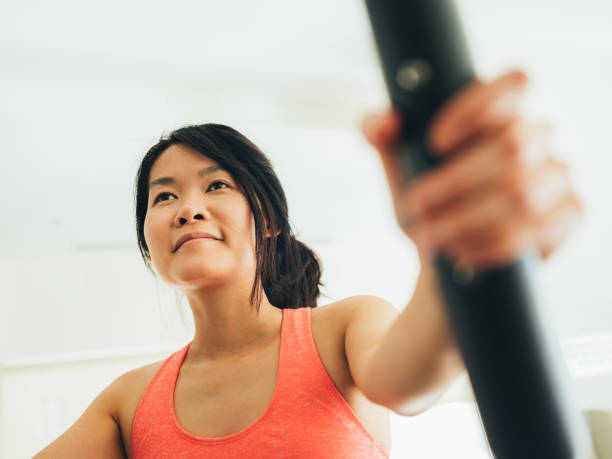 istock Young Asian woman working out 1134524312