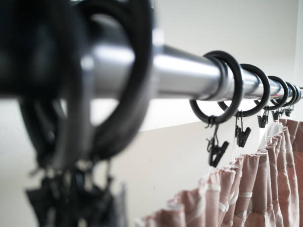 Hanging the curtains Curtains installation procedure curtain rail stock pictures, royalty-free photos & images