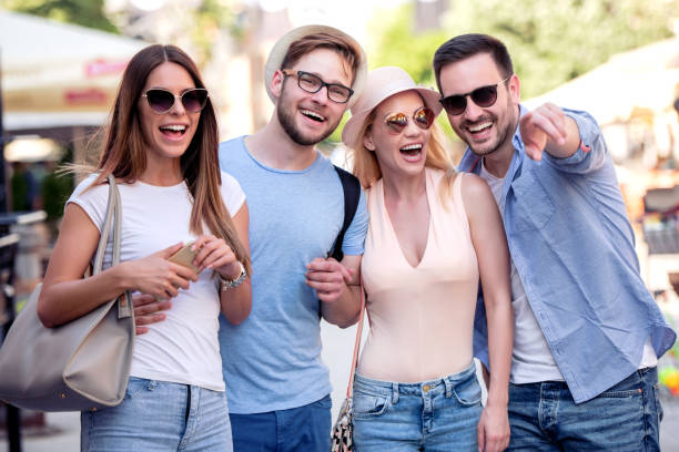 istock Group of young people walking through city 1134528370