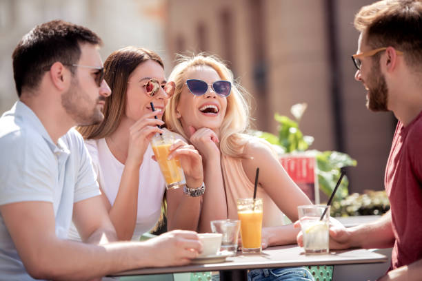 istock Group of four friends having fun in cafe 1134528376