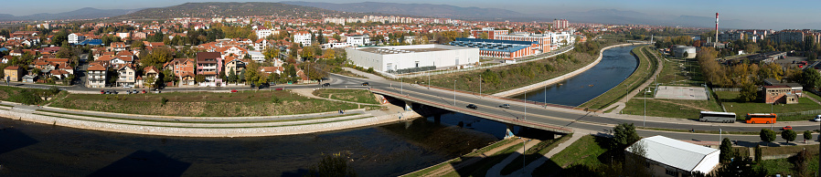 Panoramic shot of a part of the city with river and brigde across it. City of Nis, Serbia