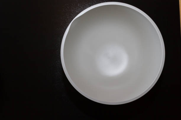 istock A bowl for kneading the dough with a white bottom is on the table 1134531057