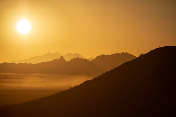 istock Warm Desert Sunrise with Mountains 1134533030