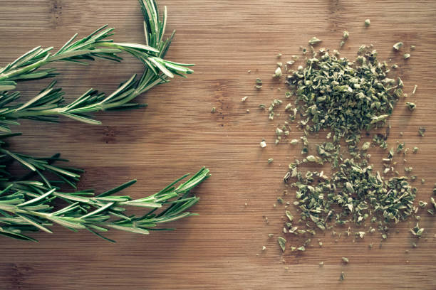 Oregano herb scattered across the kitchen board