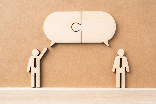 wooden businessman with conversation concept