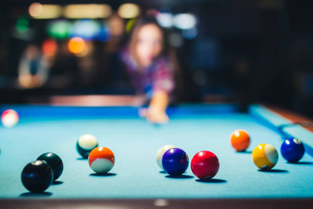 istock Woman and plays billiard and have fun. 1134534571